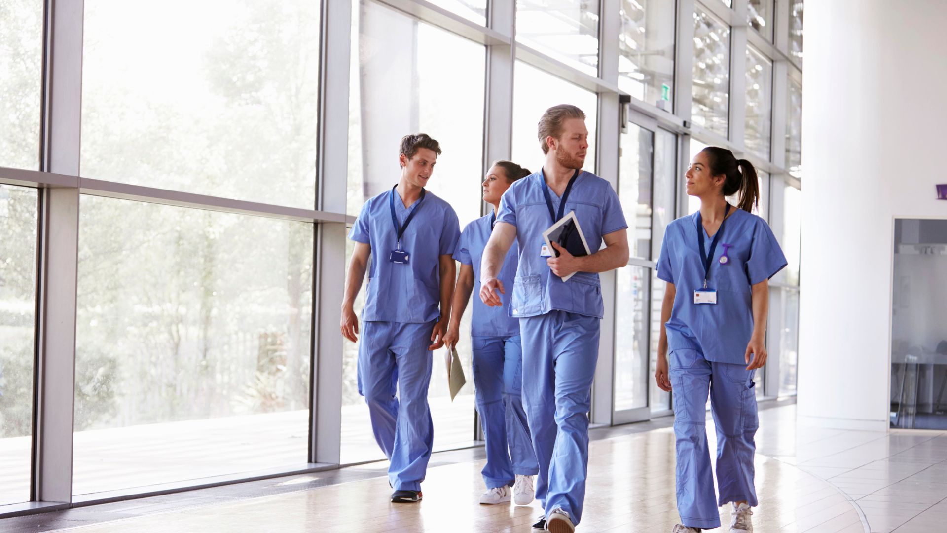 nurses walking in hallway in hospital