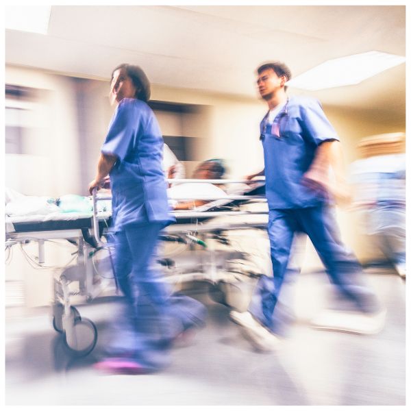 nurses rushing to help a patient