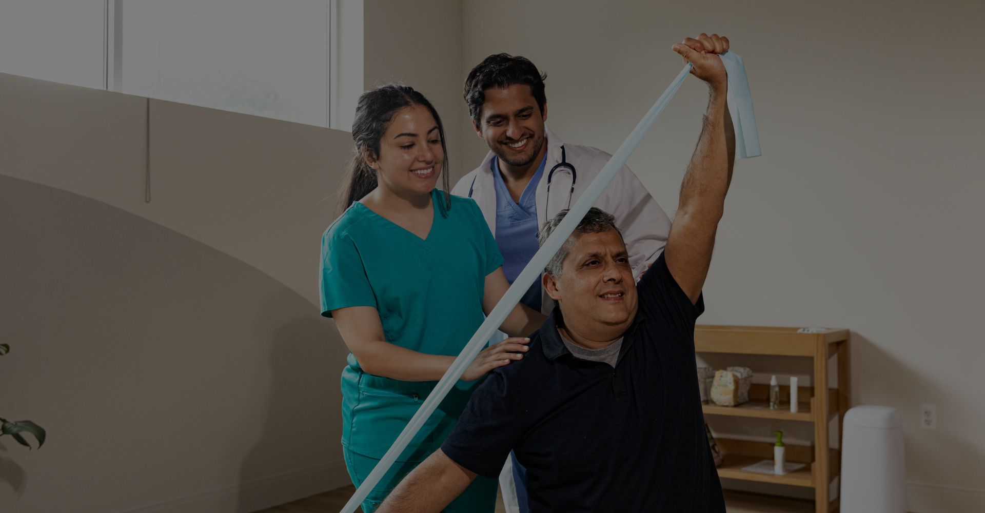 occupational therapists working on rehab with a patient