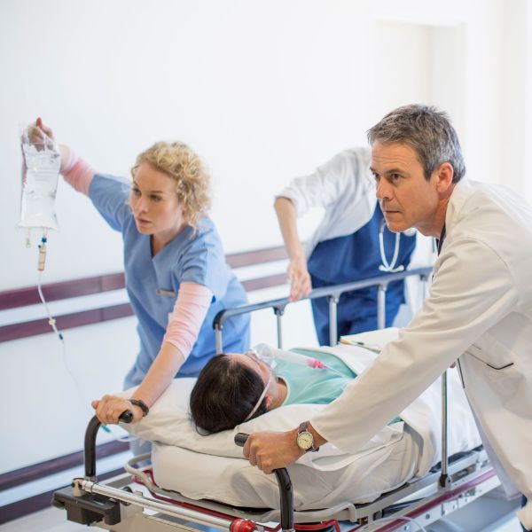 healthcare workers helping an emergency patient